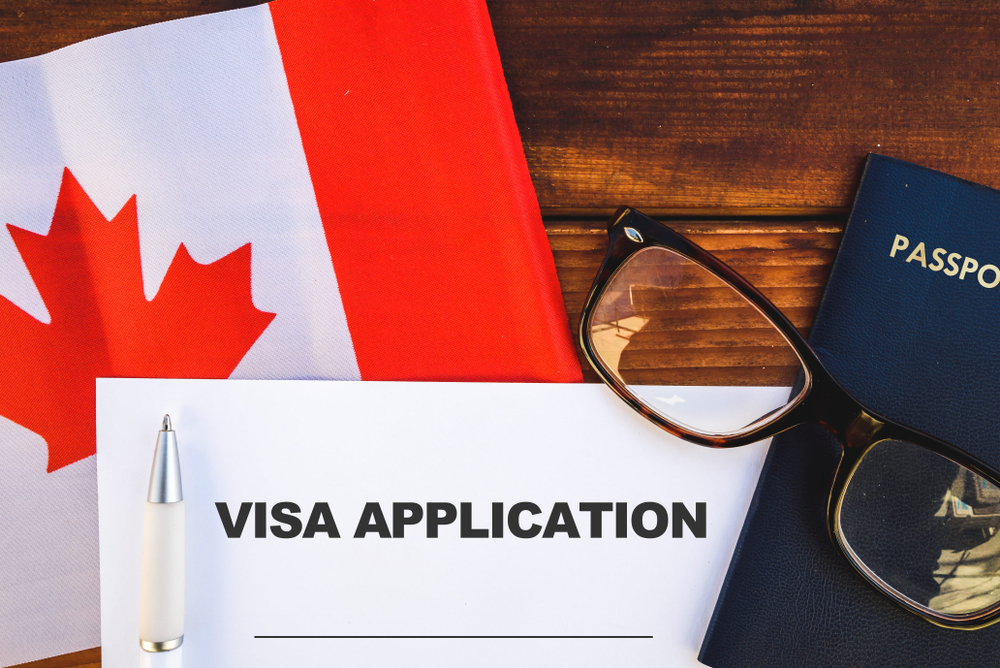 Canada visa for people living in Saudi Arabia: Image of a visa application form and flag in Canada.