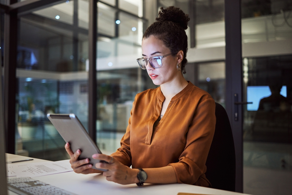 Best and Worst Cities for Jobs in Canada: A picture showing an immigrant working overnight in one of the best Canadian cities for job seekers.