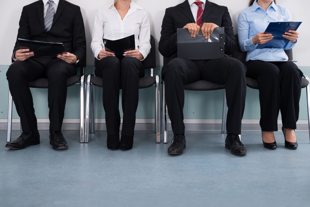 First-Time Job Seekers in Canada: A picture showing a group of first-time job seekers sitting in queue, waiting for Canadian job recruiter.