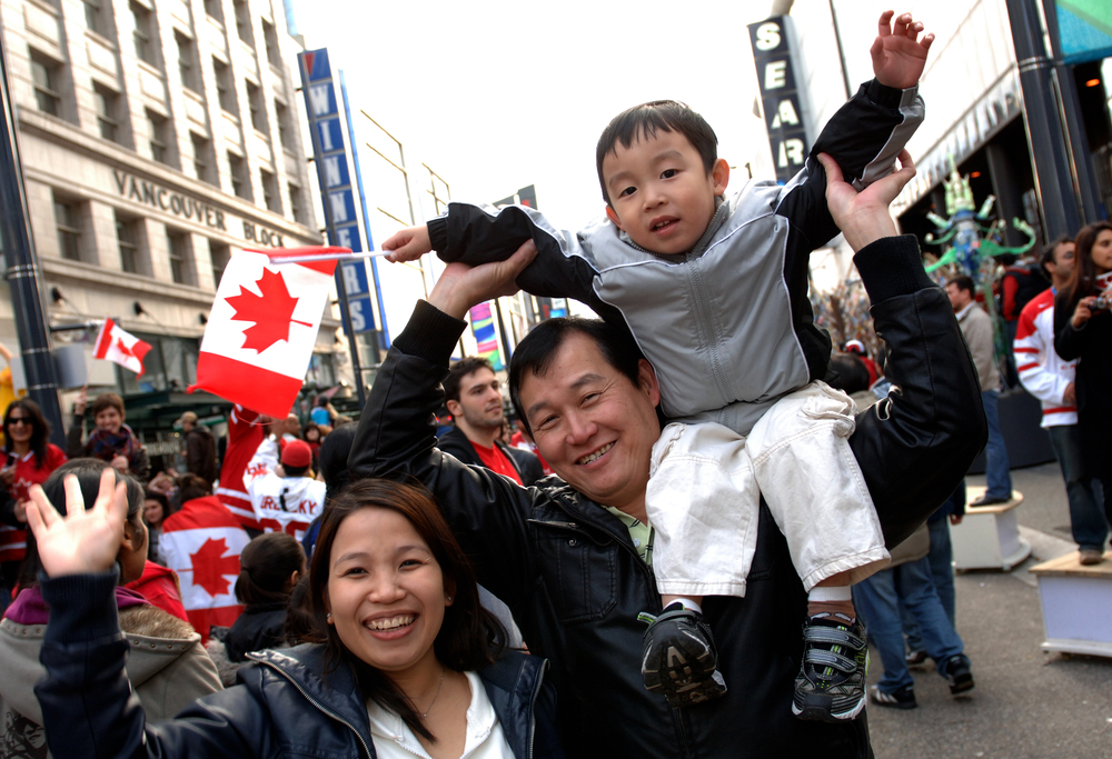 Express Entry vs Family Sponsorship: A picture showing a couple and child in Canada who got into the country on Express Entry visa opportunity.