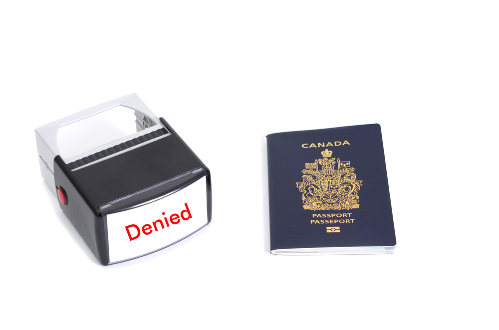 Canada Visa Rejection Triggers to Avoid at All Costs: Canadian passport and denied stamp on white background